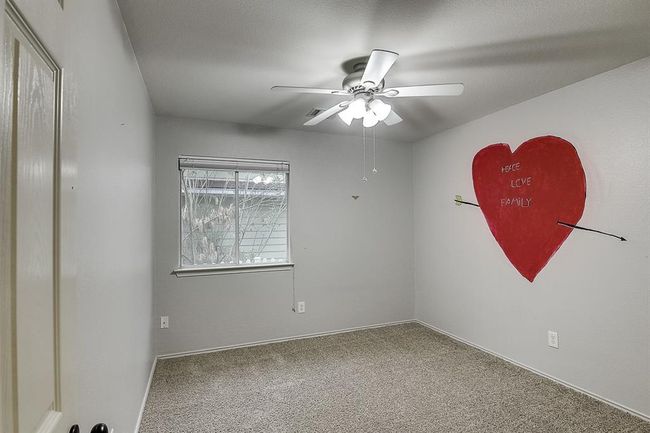 Carpeted spare room with a ceiling fan | Image 15