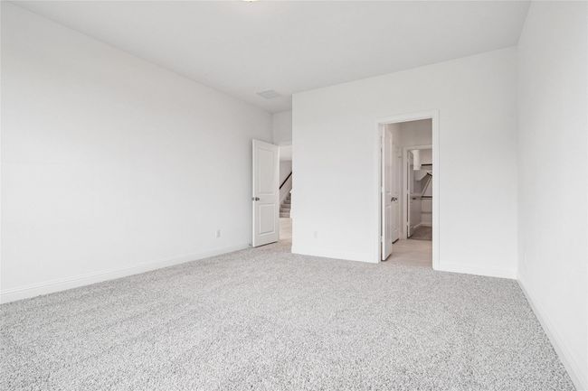 Unfurnished bedroom with light colored carpet and baseboards | Image 20