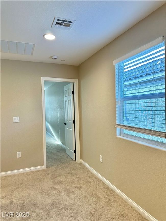 Empty room featuring carpet, visible vents, and baseboards | Image 26