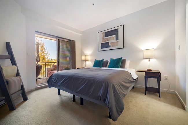 Bedroom with carpet floors, access to exterior, and baseboards | Image 13
