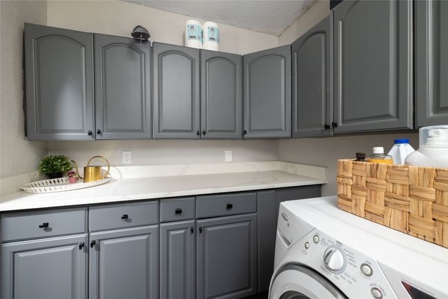 Laundry room with cabinet space and washer and dryer | Image 18