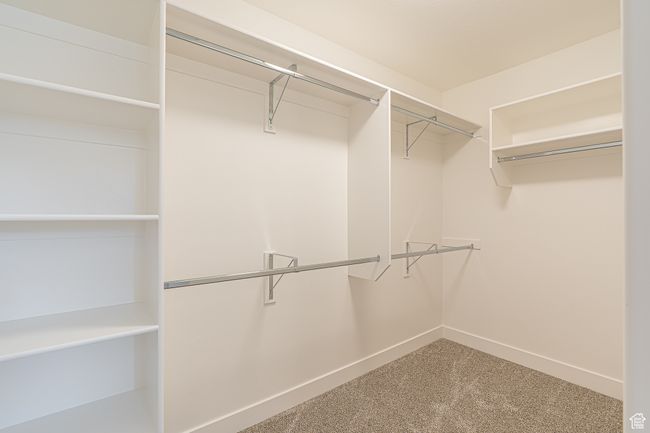 Walk in closet featuring carpet | Image 21