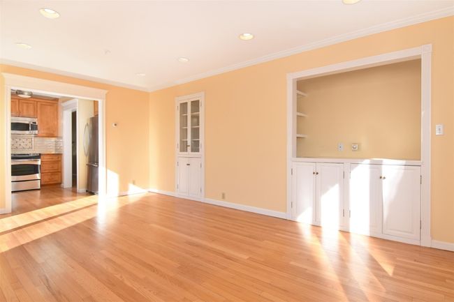 First Floor Family Room with built in features, recessed lighting, light wood-style floors, crown molding, and baseboards | Image 7