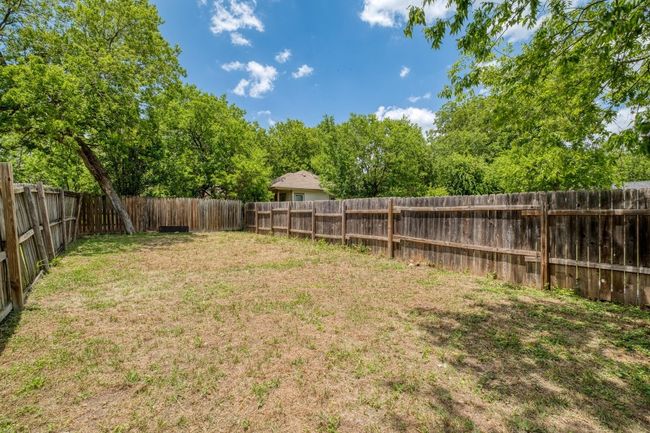View of fenced backyard | Image 40