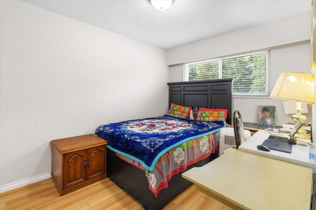 Bedroom with light wood finished floors and baseboards | Image 20