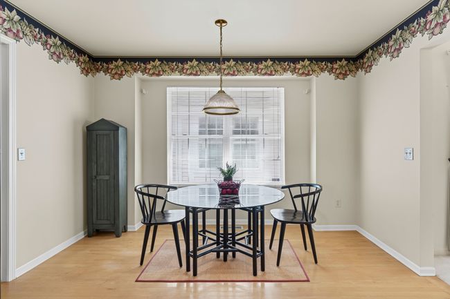 Eating nook w/large window for natural lighting | Image 13