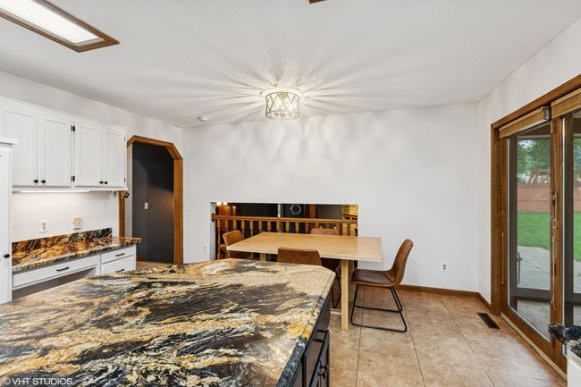 See the informal dining area just steps from the kitchen—perfect for casual meals | Image 17