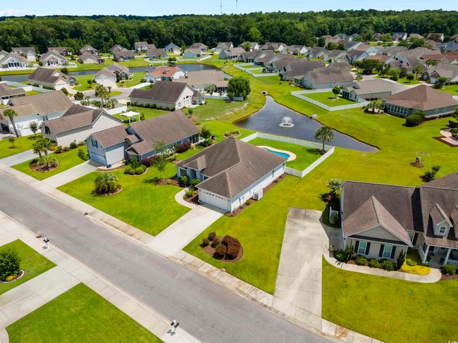 Aerial perspective of suburban area featuring a nearby body of water | Image 20