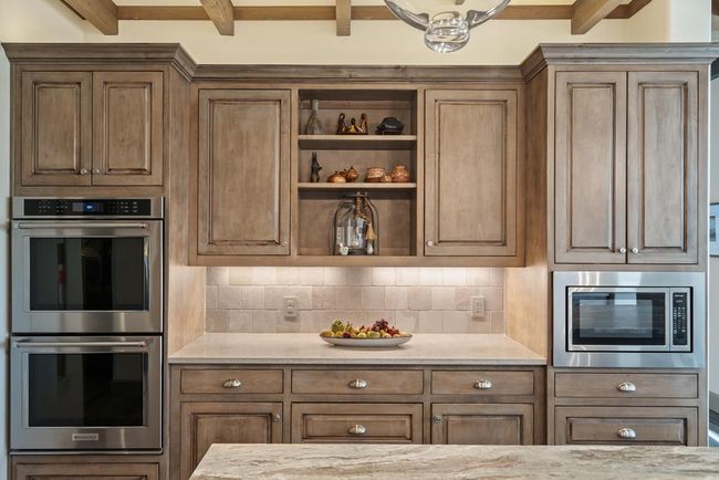 Beautiful custom cabinets with double ovens | Image 19