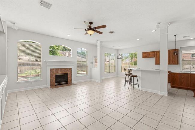 View of family room opening to kitchen | Image 17