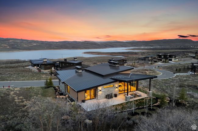 Aerial view at dusk featuring a water and mountain view | Image 8