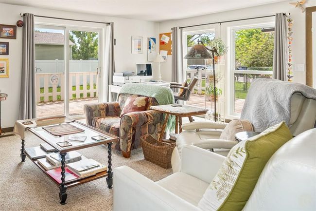 Living room with sliding door and huge windows for light | Image 10