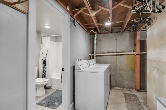 Washroom with washing machine and clothes dryer | Image 24
