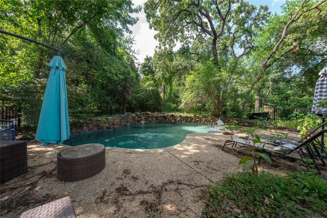 Swimming pool with a patio area | Image 31