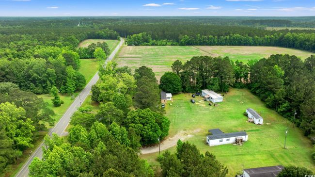 Overview of rural landscape with a heavily wooded area | Image 36