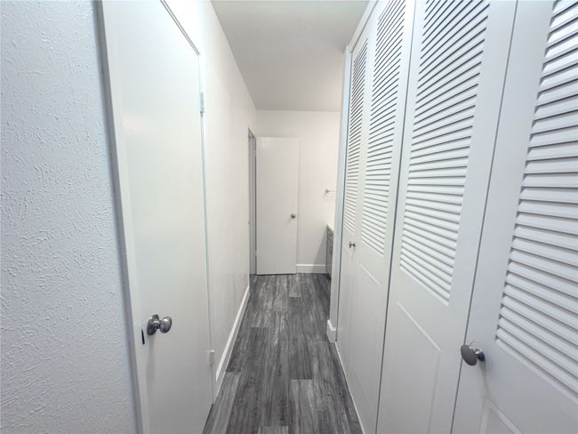 Corridor with dark wood-type flooring | Image 11