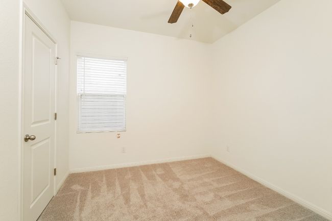 Unfurnished room with light carpet and ceiling fan | Image 16