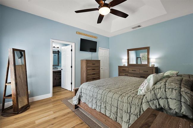 Trey ceiling and walk-in closet featured in Primary bedroom | Image 14
