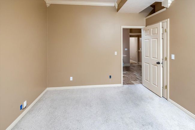Bedroom #6 with crown molding and light colored carpet | Image 28
