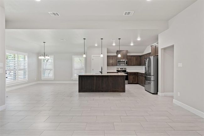 Open Kitchen with center island seating. | Image 7