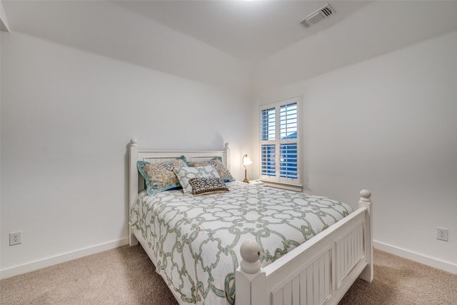 Bedroom with carpet flooring, visible vents, and baseboards | Image 28
