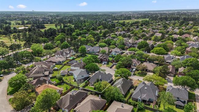 This aerial view offers a broader perspective of the home's location within Windrose, highlighting its proximity to the golf course and its placement on the peaceful cul-de-sac. | Image 39