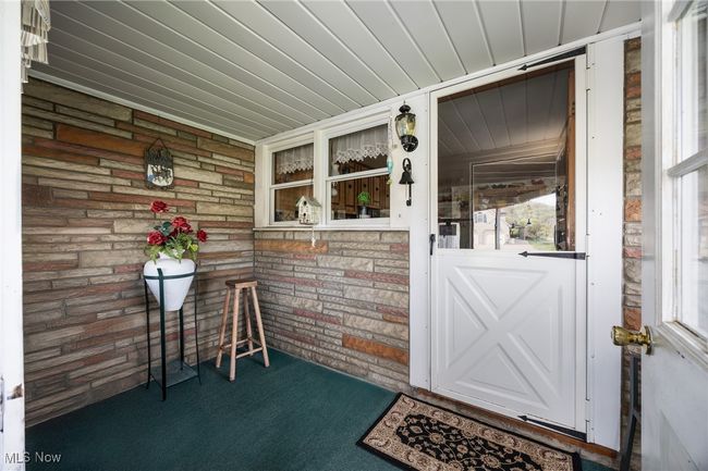Entrance to property with a porch | Image 7