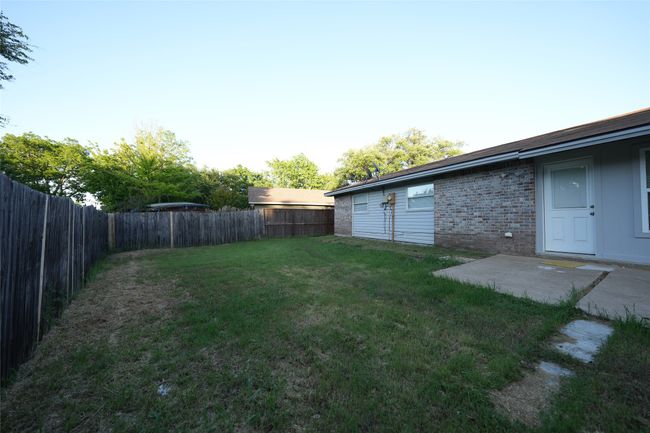 View of yard featuring a fenced backyard | Image 17