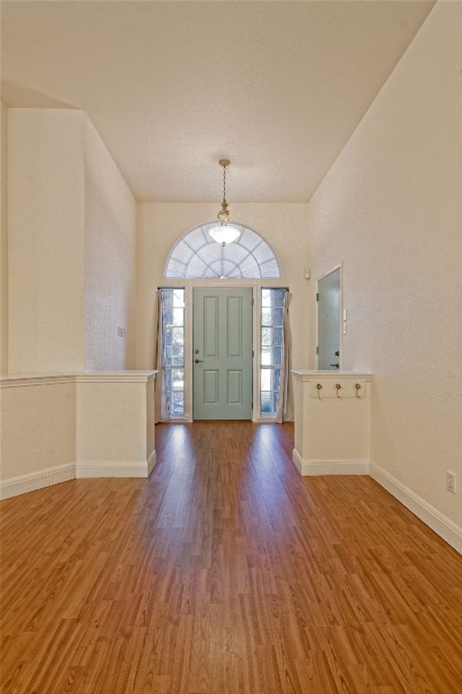 Entrance foyer with wood finished floors and baseboards | Image 5