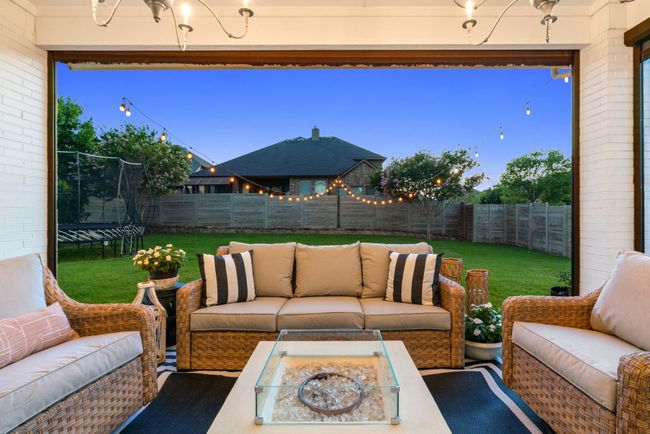 View of patio / terrace with a trampoline and an outdoor living space with a fire pit | Image 38