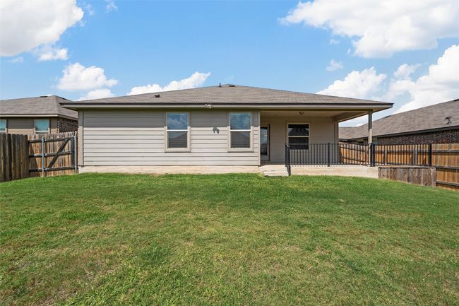 Back of property featuring a patio area and a fenced backyard | Image 32