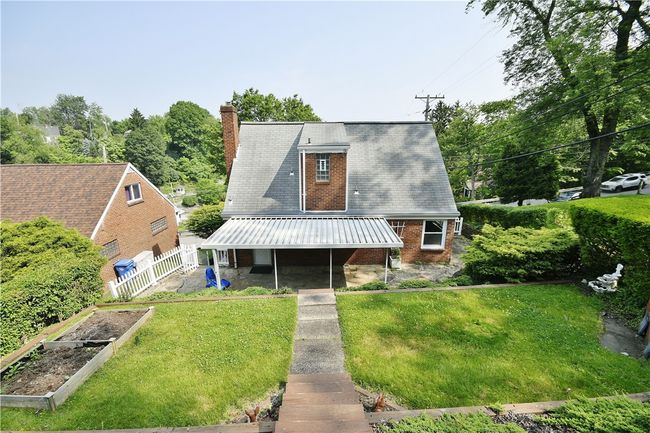 Tiered yard with lots of useable level space for outdoor fun or gardening. | Image 24