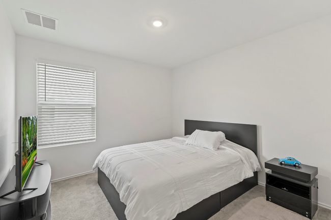 Carpeted bedroom with baseboards | Image 20