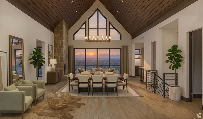 Dining space featuring wood finished floors, high vaulted ceiling, wooden ceiling, a water view, and a chandelier | Image 6