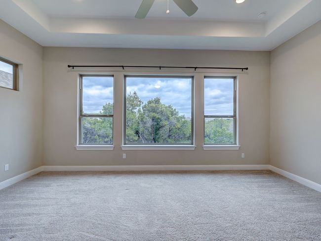 Master bedroom boasts recessed ceiling & beautiful views | Image 19