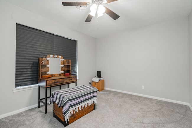 Carpeted bedroom featuring ceiling fan | Image 5