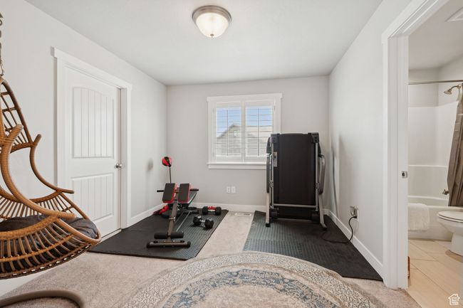Exercise area featuring baseboards | Image 15