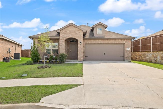 Front exterior view of 2 car garage, long drive way, corner lot, on a culdesac. | Image 6