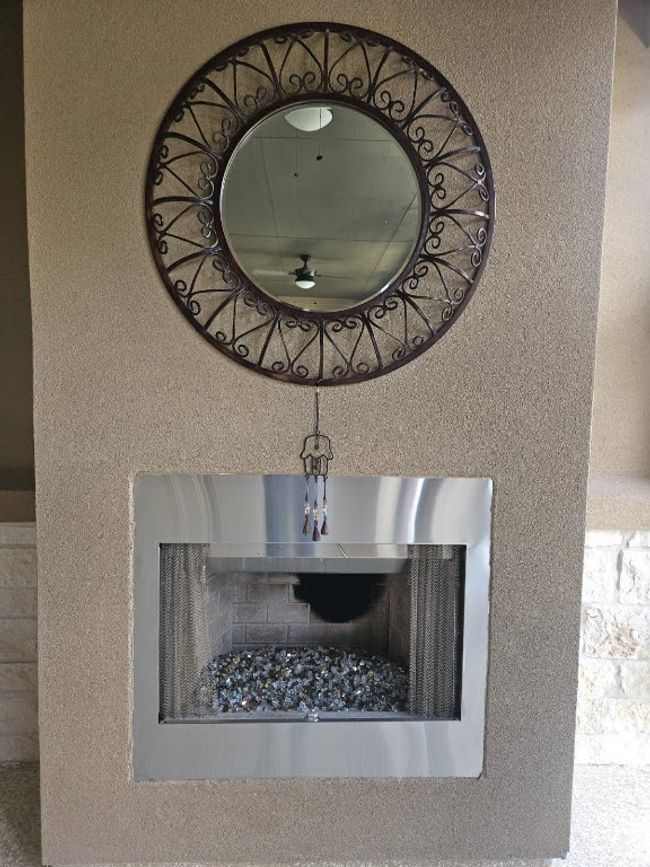 Detailed view of a fireplace and ceiling fan | Image 11