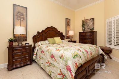 Tiled bedroom with ornamental molding | Image 3