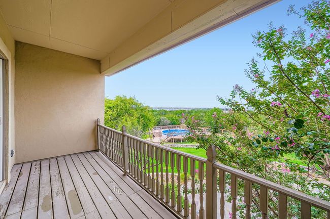 Balcony overlooking backyard; access from flex space and guest bedroom #2 | Image 24