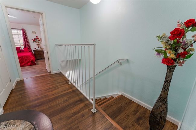 Stairs with wood finished floors and baseboards | Image 18
