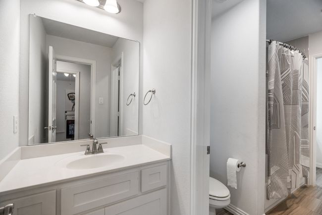 Bathroom featuring vanity and a shower with curtain | Image 30