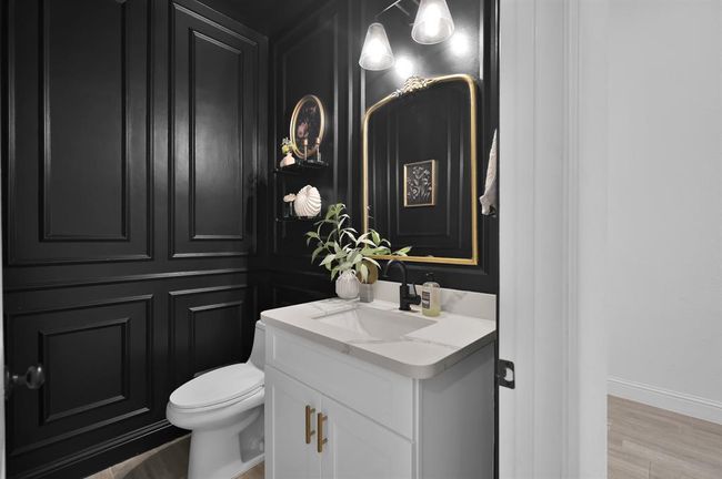 Half bath with paneling and custom lightning. | Image 29