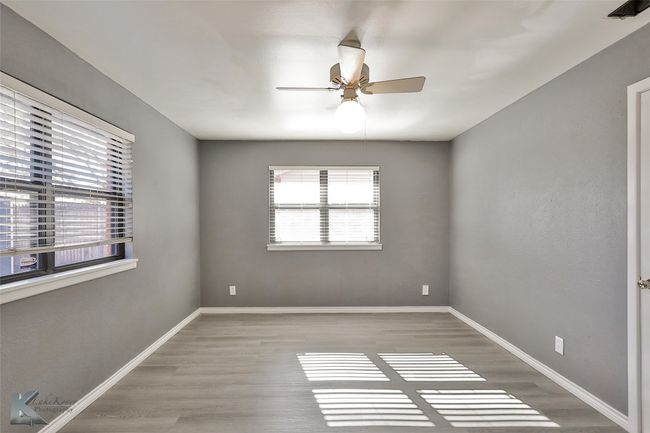 Spare room featuring ceiling fan and light hardwood / wood-style floors | Image 12