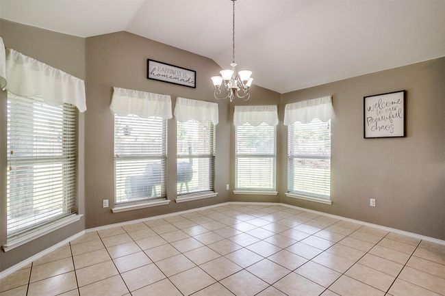 Dining area with light tile | Image 16