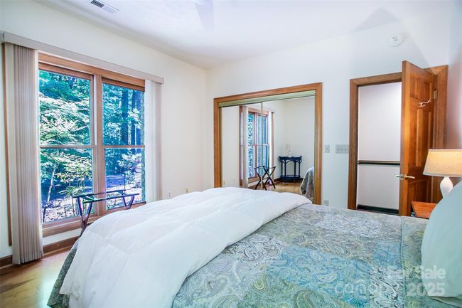 Guest room #1, with large windows for a great view of the greenery. | Image 31