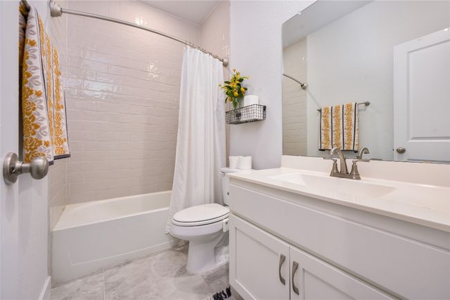 Bathroom with shower / bath combo with shower curtain and vanity | Image 13