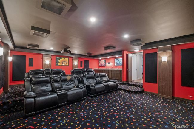 Home theater room featuring carpet and baseboards | Image 28