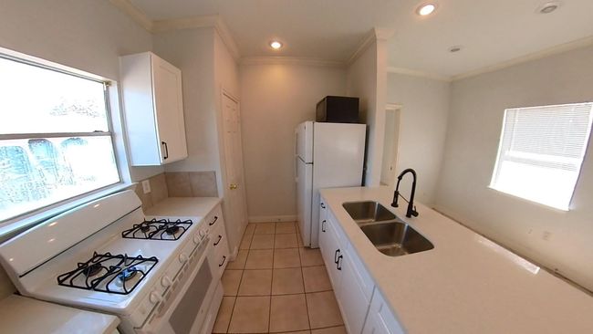 Remodeled kitchen at the 5508 Texas upstairs unit. | Image 5